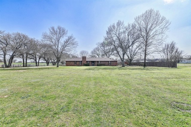 view of yard with a rural view