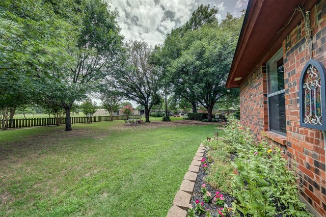 view of yard featuring an outdoor fire pit