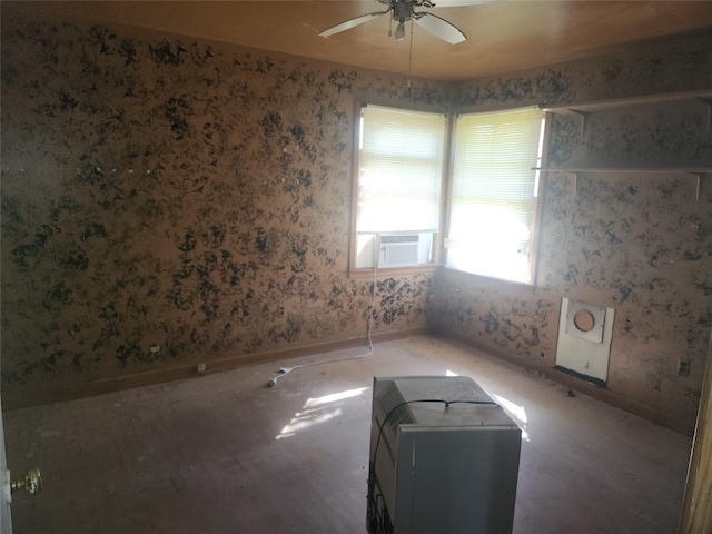 spare room with hardwood / wood-style floors and ceiling fan