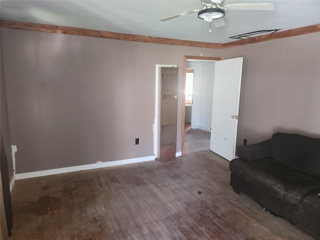 living room with ceiling fan and dark hardwood / wood-style floors