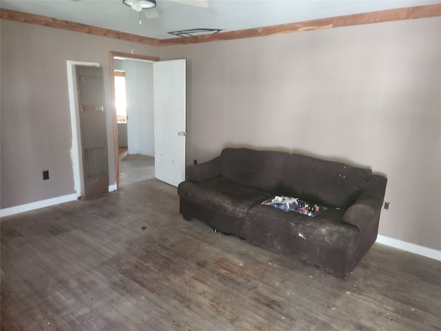 living room featuring ceiling fan and dark wood-type flooring