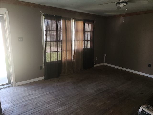 unfurnished room with ceiling fan and dark wood-type flooring