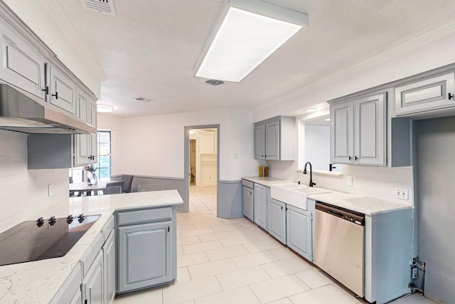 kitchen with light tile floors, stainless steel dishwasher, gray cabinets, and sink