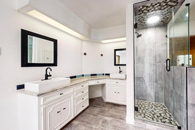 bathroom with an enclosed shower, ornamental molding, tile floors, and vanity with extensive cabinet space