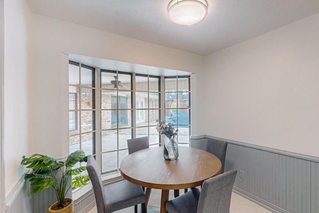 dining space with light tile floors