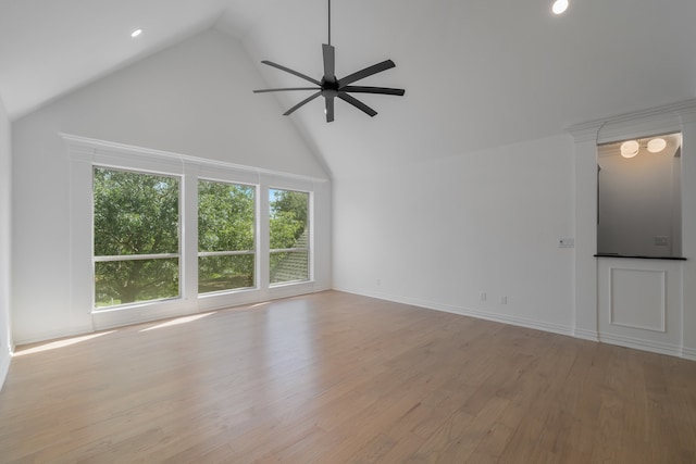 unfurnished living room with light hardwood / wood-style flooring, high vaulted ceiling, and ceiling fan