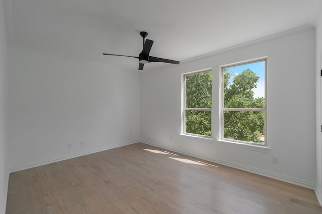 unfurnished room with ornamental molding, light wood-type flooring, and ceiling fan