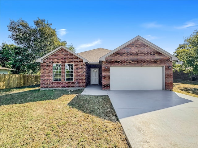 single story home featuring a front yard and a garage