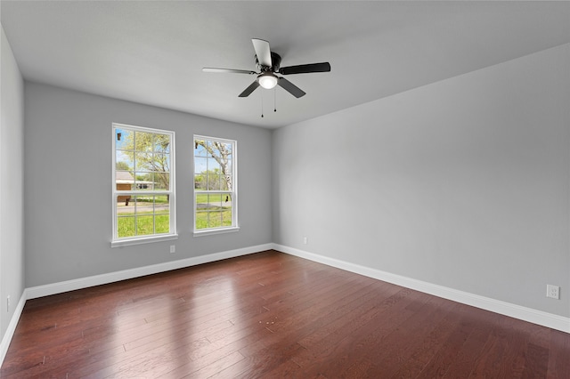 unfurnished room featuring dark hardwood / wood-style floors and ceiling fan