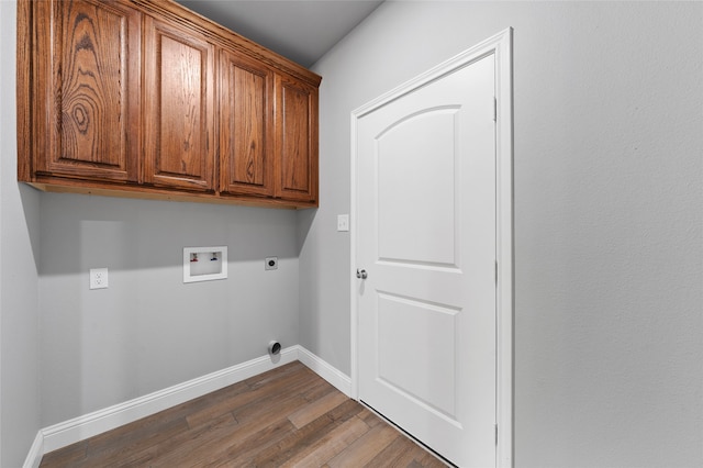 laundry room with hookup for an electric dryer, washer hookup, cabinets, and dark hardwood / wood-style flooring