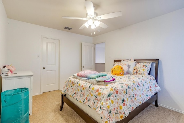 bedroom with light carpet and ceiling fan