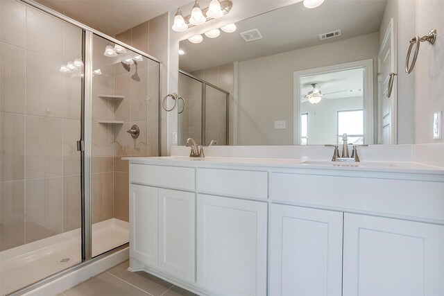 bathroom featuring vanity and a shower with shower door