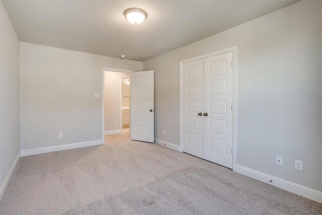 carpeted spare room with a textured ceiling