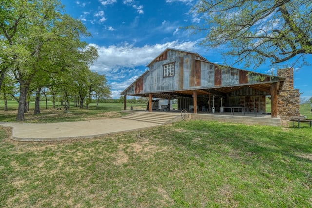 rear view of house with a lawn