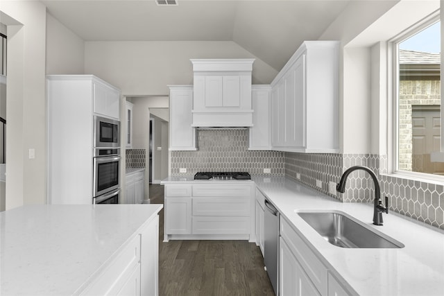 kitchen featuring white cabinets, light stone countertops, sink, and stainless steel appliances