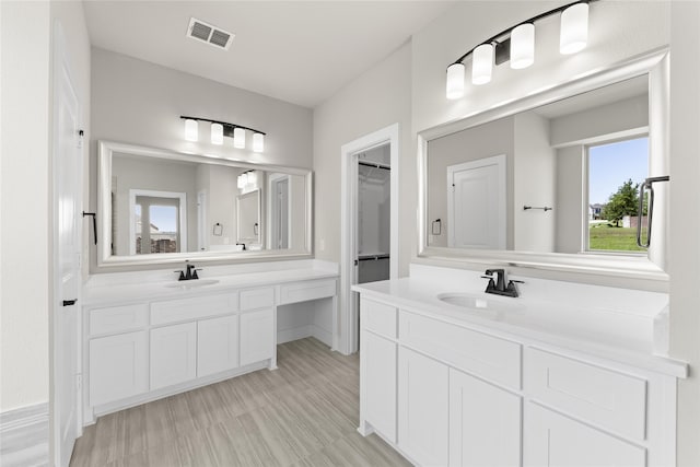 bathroom featuring vanity and wood-type flooring