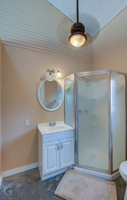 bathroom featuring an enclosed shower, vanity, wooden ceiling, toilet, and vaulted ceiling