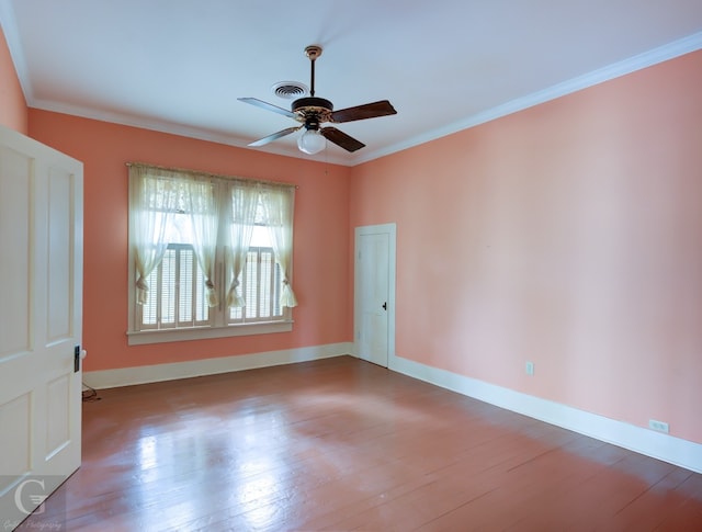 spare room with ceiling fan, ornamental molding, and dark hardwood / wood-style flooring