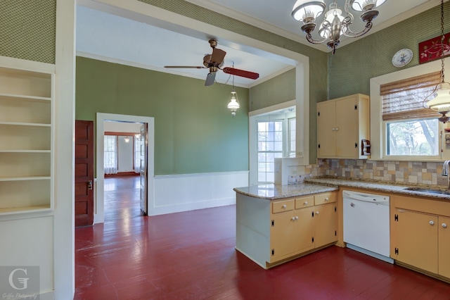 kitchen featuring tasteful backsplash, dark wood-type flooring, dishwasher, and ceiling fan with notable chandelier