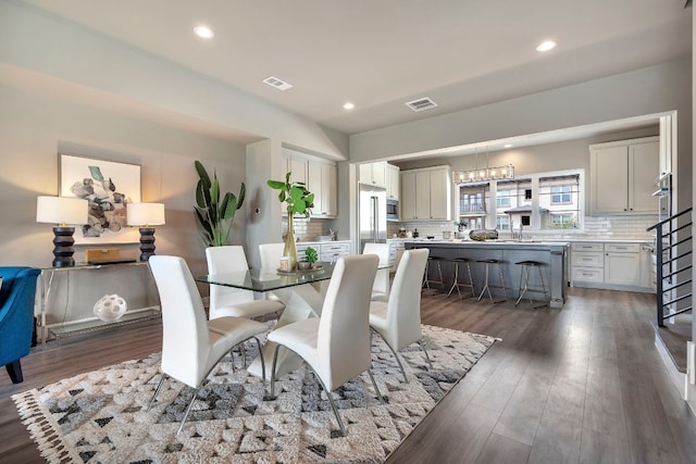 dining space featuring dark hardwood / wood-style floors