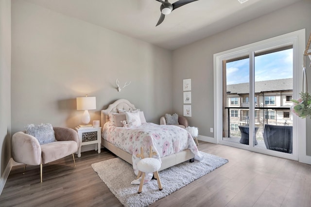 bedroom with ceiling fan, access to outside, and hardwood / wood-style floors