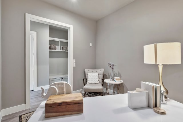 living area with hardwood / wood-style floors