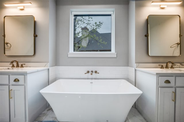 bathroom with a tub, tile floors, and dual bowl vanity