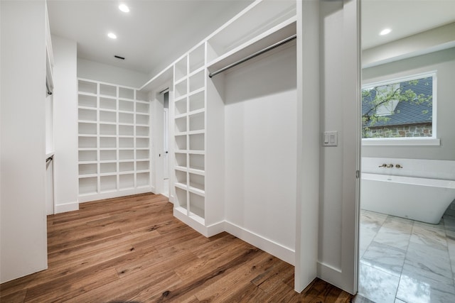 spacious closet featuring tile flooring