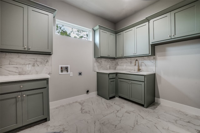 laundry room featuring cabinets, sink, light tile flooring, washer hookup, and hookup for an electric dryer