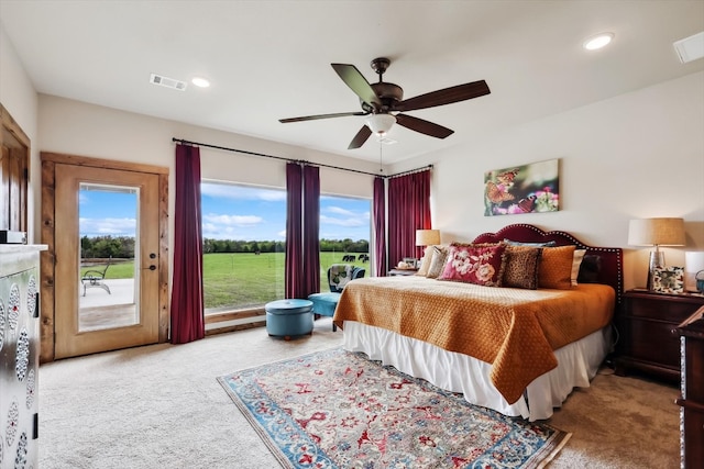 bedroom featuring light carpet, ceiling fan, and access to outside