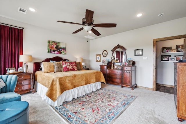 bedroom featuring light carpet and ceiling fan