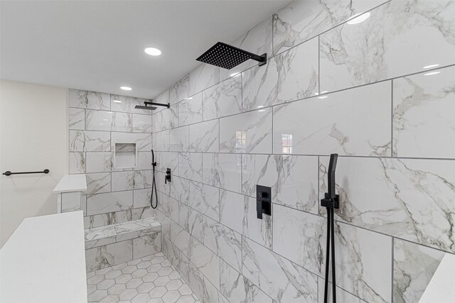 bathroom with tiled shower