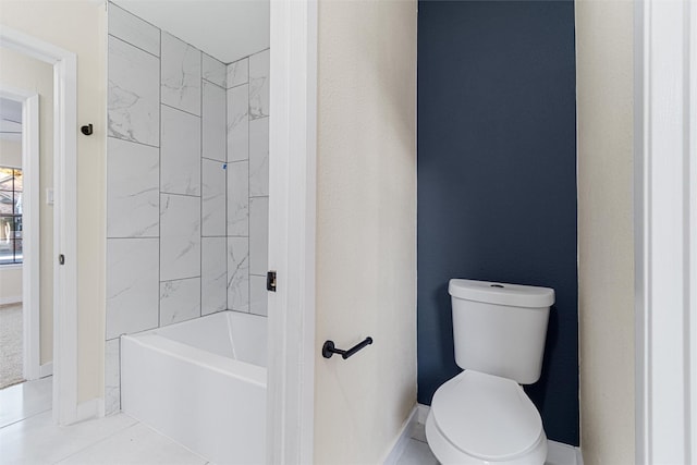 bathroom with tile patterned flooring and toilet