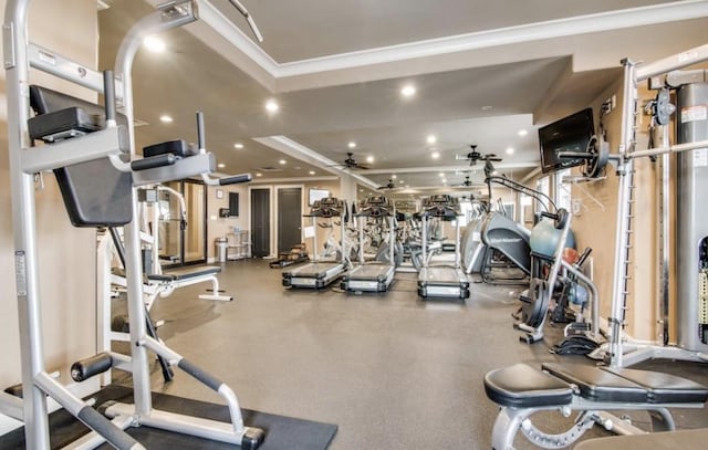 exercise room with ceiling fan and crown molding