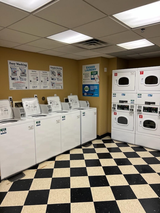 laundry room featuring stacked washer and clothes dryer and washer and clothes dryer