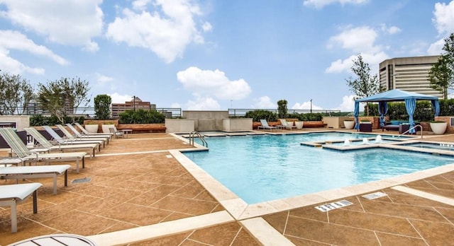 view of pool featuring a gazebo and a patio area