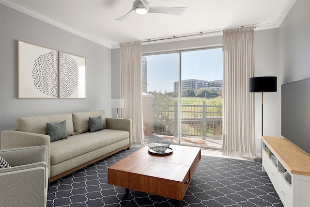 living room featuring ceiling fan and ornamental molding