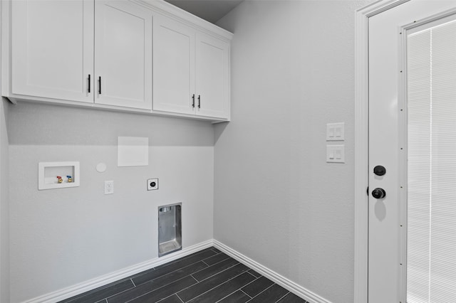 laundry area with cabinets, washer hookup, hookup for an electric dryer, dark hardwood / wood-style floors, and hookup for a gas dryer