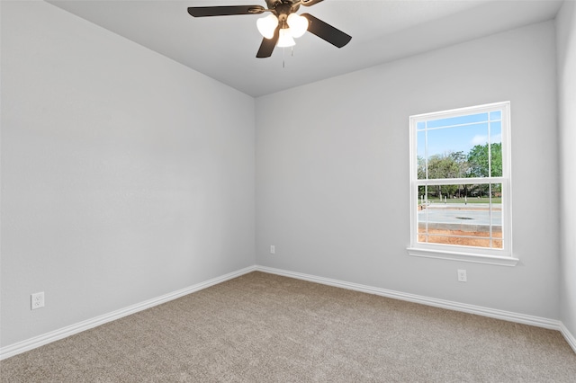 empty room with carpet and ceiling fan