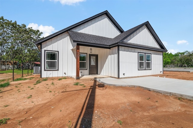 modern inspired farmhouse with central air condition unit