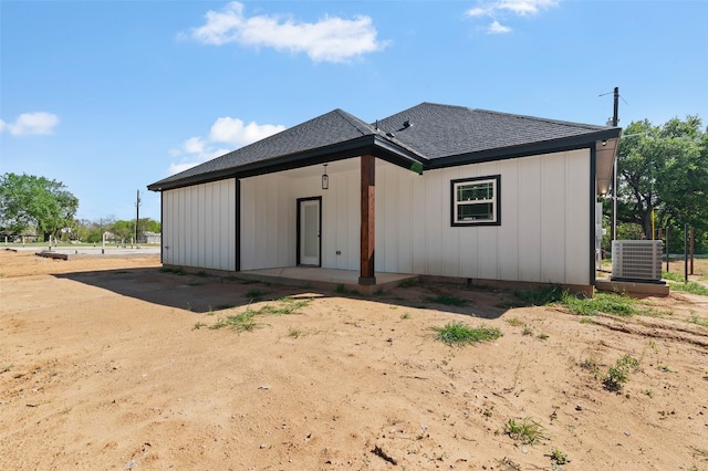 back of property with central AC