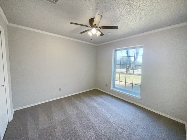 unfurnished room featuring ornamental molding, a textured ceiling, ceiling fan, and dark carpet