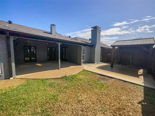 exterior space with a lawn and a patio area