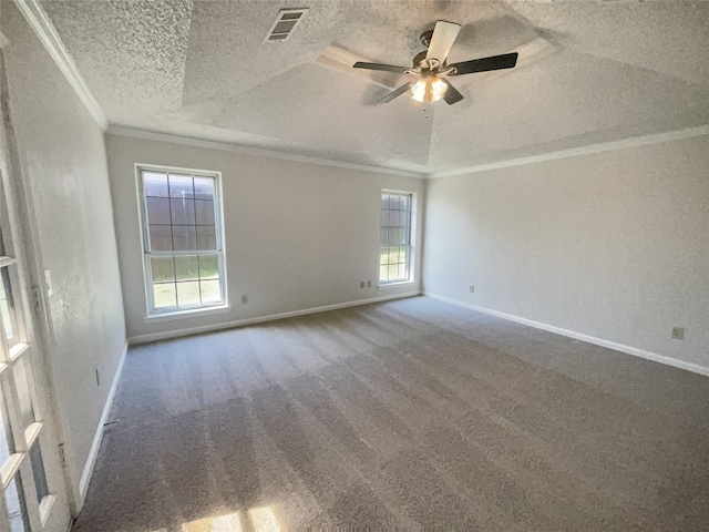 carpeted spare room with plenty of natural light, a textured ceiling, and ceiling fan