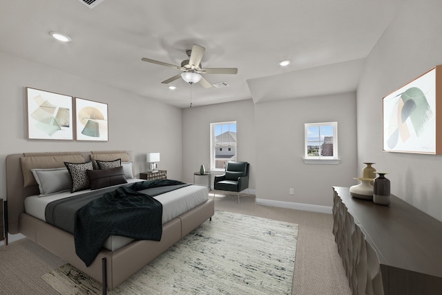 bedroom featuring ceiling fan and light carpet