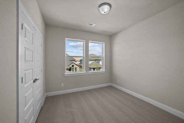 empty room with carpet flooring