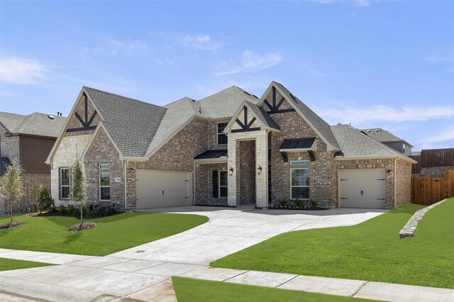 view of front of house with a front lawn and a garage