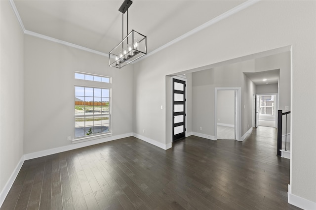 unfurnished dining area with a healthy amount of sunlight, dark hardwood / wood-style floors, and crown molding