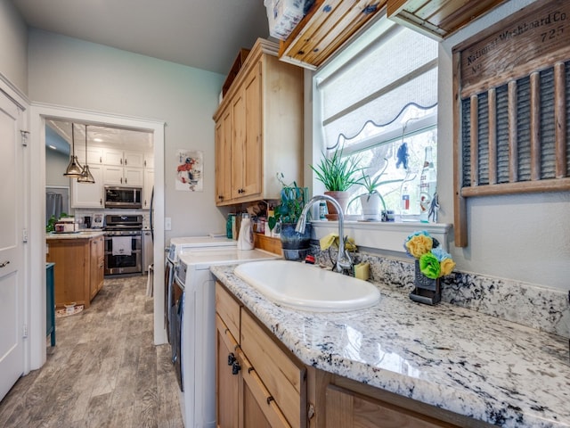 interior space featuring vanity with extensive cabinet space and hardwood / wood-style flooring