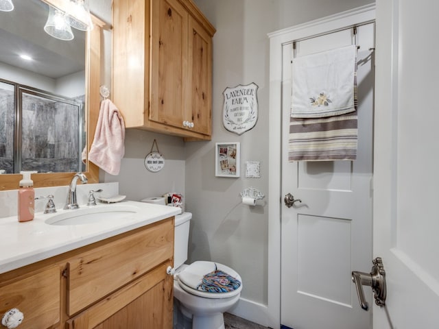 bathroom featuring oversized vanity and toilet